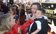 Carrie Underwood, husband Mike Fisher and son Isaiah at her Star Ceremony On The Hollywood Walk Of Fame on September 20, 2018. (Image via Getty)